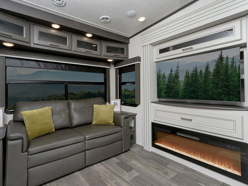 New 2024 Keystone RV Cougar interior living room with fireplace